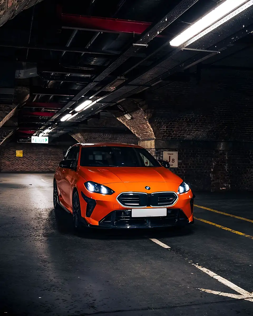 Used 2025 BMW 1 Series M135i BMW Individual Fire Orange - Front View